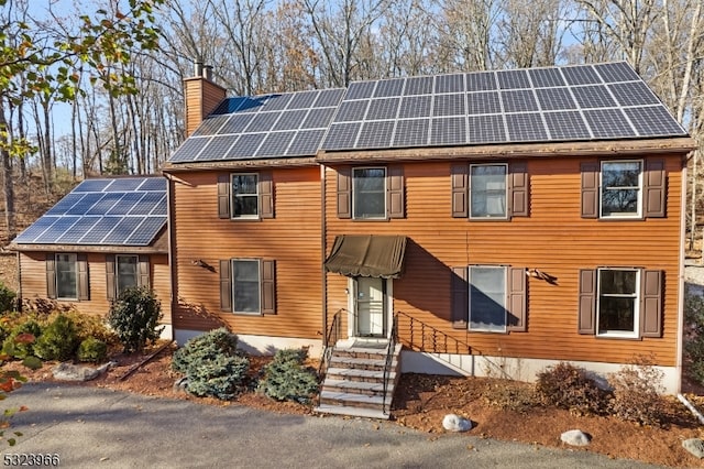 view of front of home featuring solar panels