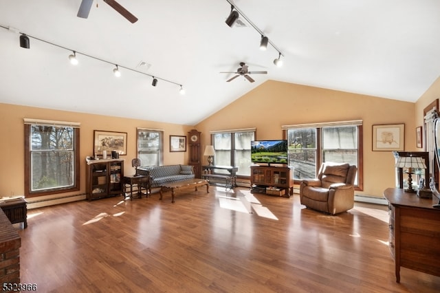 living room with ceiling fan, high vaulted ceiling, a baseboard heating unit, hardwood / wood-style floors, and track lighting