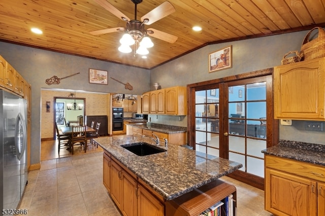 kitchen featuring a center island with sink, wood ceiling, sink, and appliances with stainless steel finishes