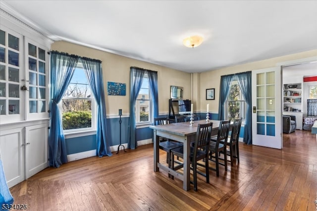 dining space featuring dark wood-type flooring