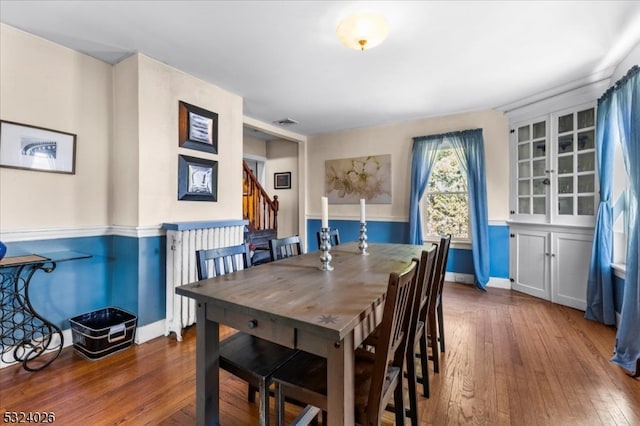 dining room with dark hardwood / wood-style floors