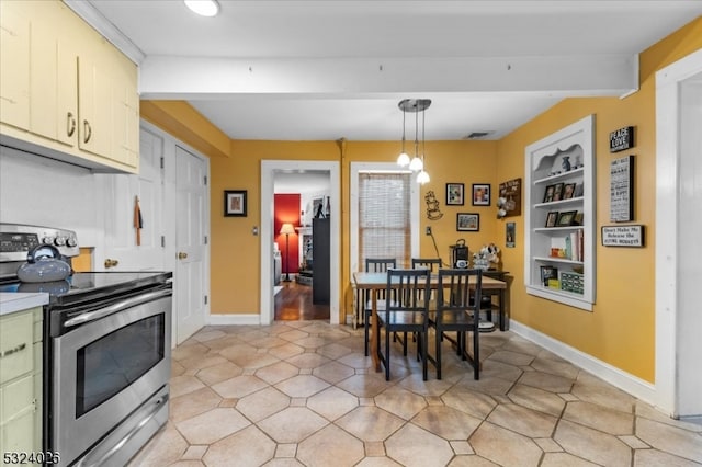 dining area featuring built in features, beamed ceiling, and a chandelier