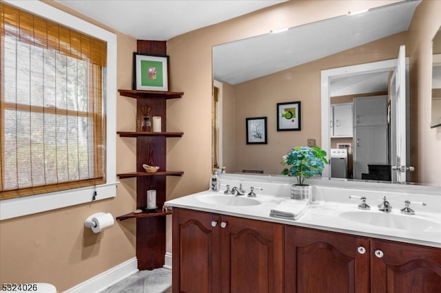 bathroom featuring vanity and vaulted ceiling