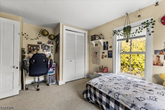 carpeted bedroom featuring a closet