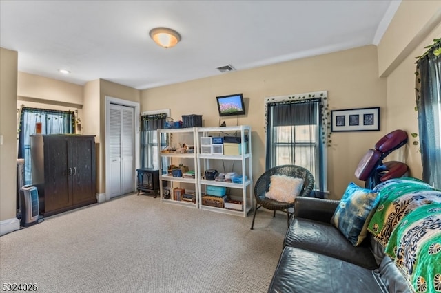 living area featuring carpet flooring