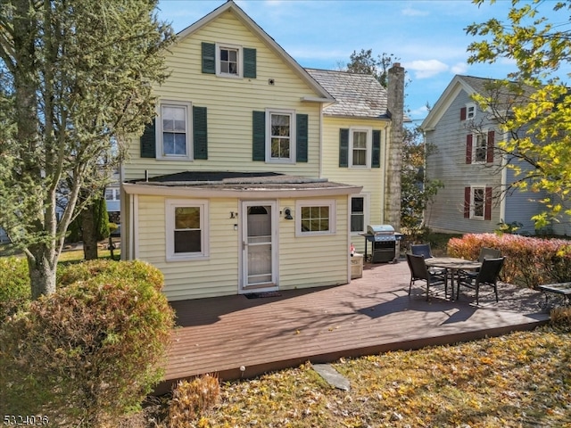 rear view of house with a deck