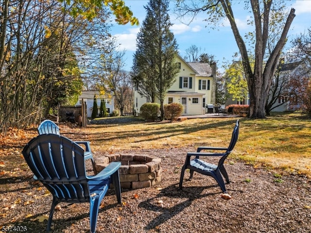 view of yard with a fire pit