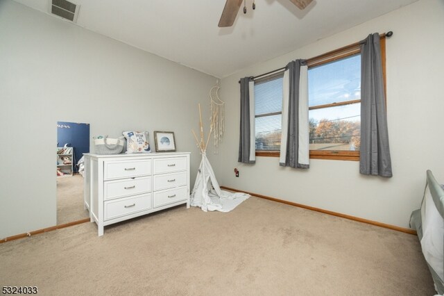 bedroom with light carpet and ceiling fan