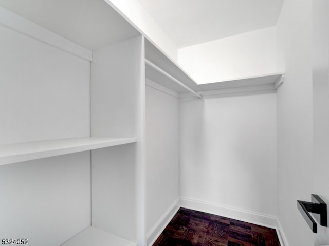 spacious closet with parquet floors