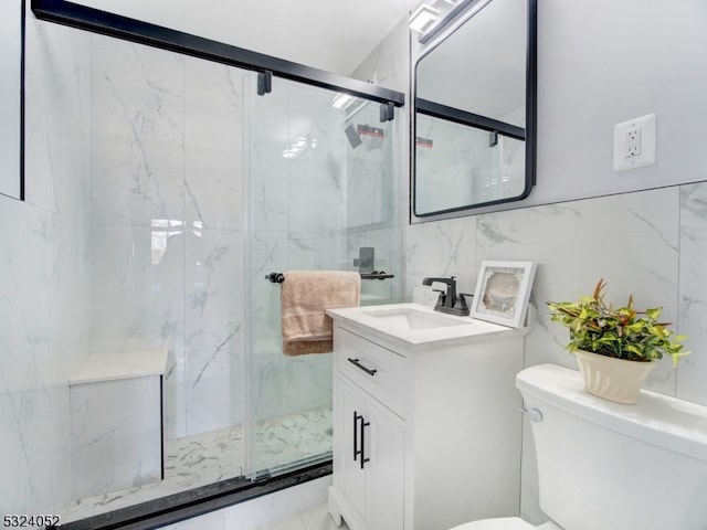 bathroom with toilet, vanity, tile walls, and walk in shower