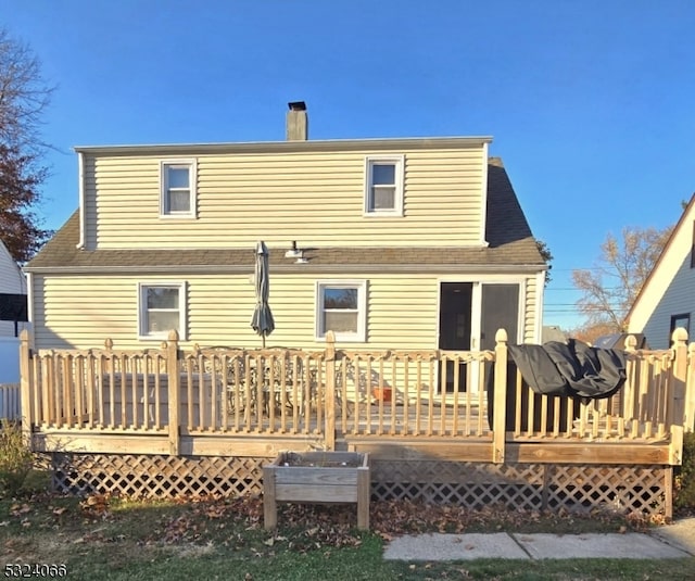 rear view of property with a deck