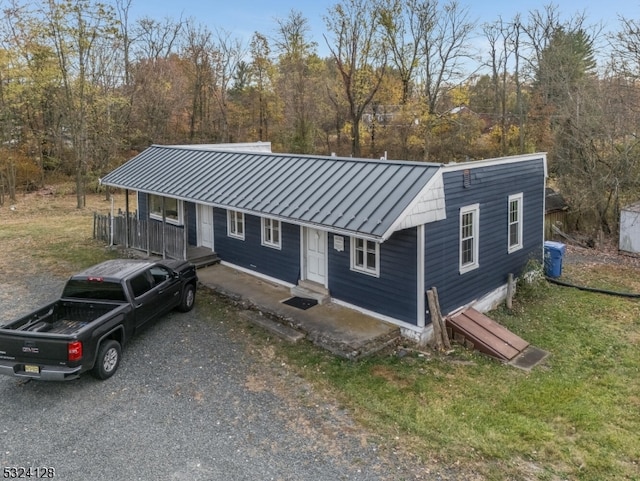 view of front facade featuring central AC unit and a porch