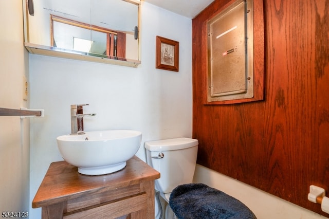 bathroom featuring toilet and vanity