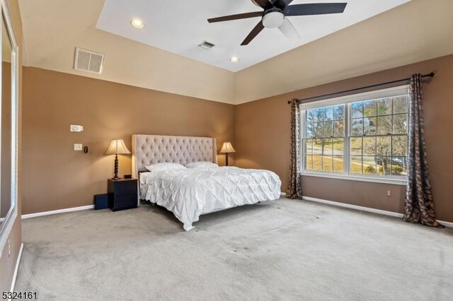 carpeted bedroom featuring recessed lighting, visible vents, baseboards, and a ceiling fan