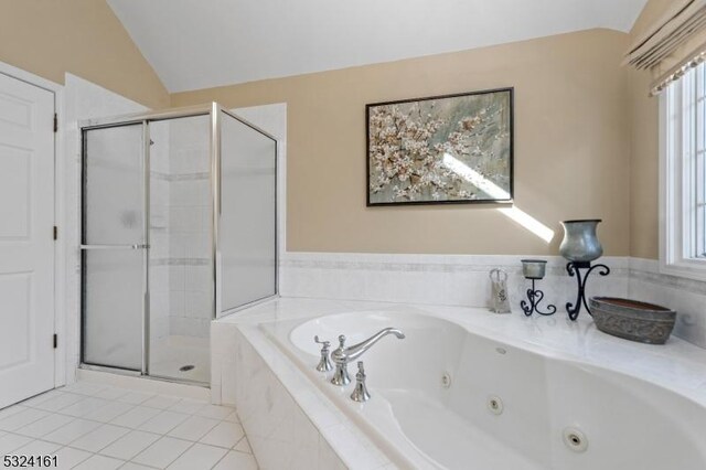 bathroom featuring tile patterned floors, a whirlpool tub, a shower stall, and vaulted ceiling