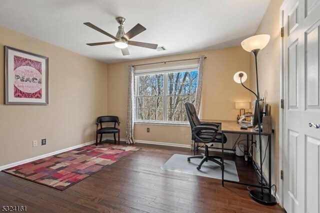 office area featuring visible vents, a ceiling fan, baseboards, and wood finished floors