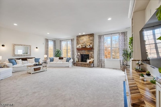 carpeted living room featuring a fireplace