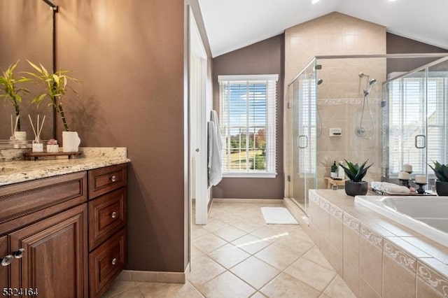 bathroom with vanity, plus walk in shower, tile patterned flooring, and vaulted ceiling