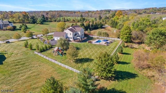 birds eye view of property with a rural view