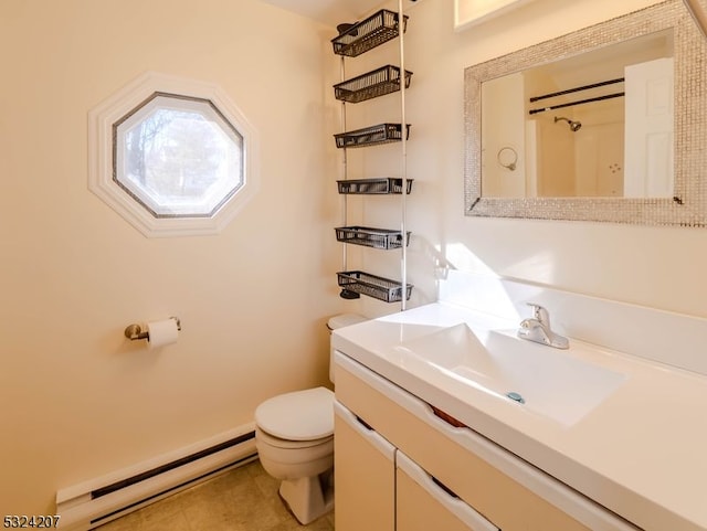 bathroom featuring vanity, a baseboard radiator, and toilet