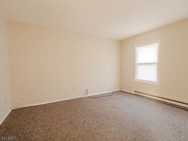 carpeted empty room with a baseboard radiator