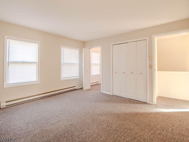 88 Trinity St, Newton Town, NJ 07860 - unfurnished bedroom featuring a baseboard heating unit, carpet flooring, and a closet