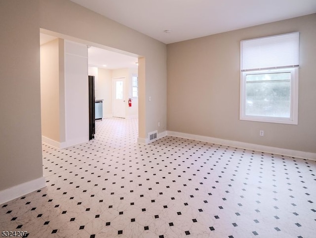 unfurnished room with a wealth of natural light