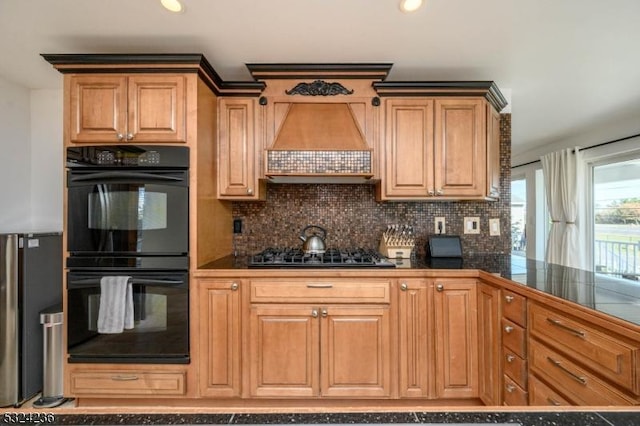 kitchen featuring dark countertops, tasteful backsplash, custom exhaust hood, gas cooktop, and dobule oven black