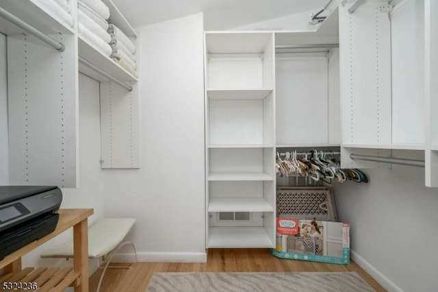 spacious closet with visible vents and wood finished floors