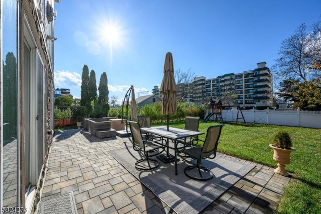 view of patio / terrace featuring outdoor dining space, an outdoor living space, and fence