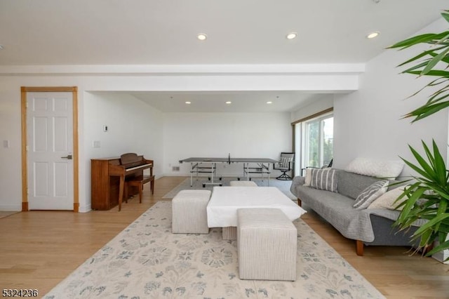 living area featuring recessed lighting, wood finished floors, and baseboards