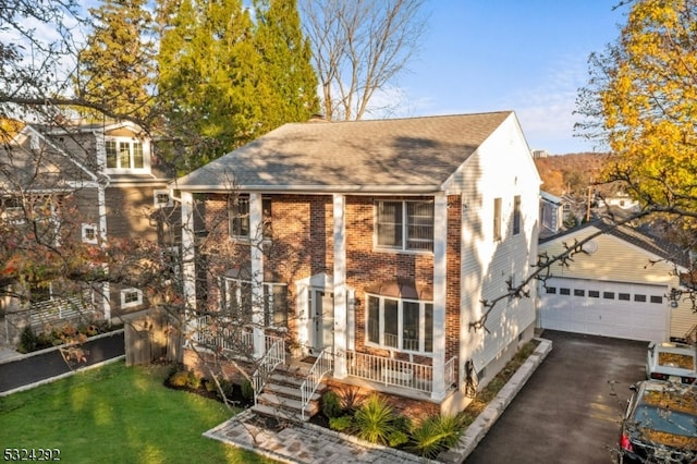 view of front of property featuring a garage and a front yard