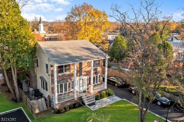 exterior space with a lawn and covered porch