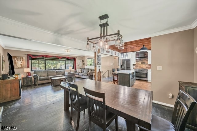 dining space featuring dark hardwood / wood-style floors and crown molding