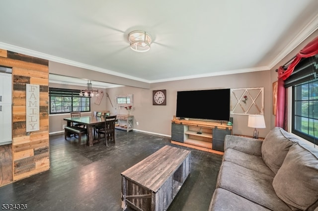 living room with dark hardwood / wood-style flooring, a notable chandelier, and crown molding