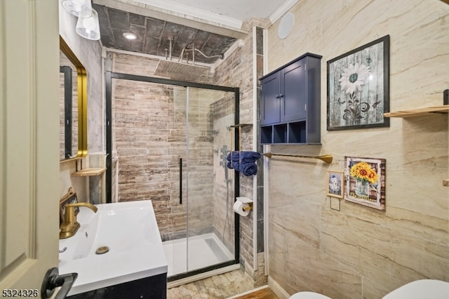 bathroom with toilet, vanity, wood-type flooring, and a shower with door