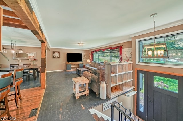 living room featuring dark wood-type flooring and ornamental molding