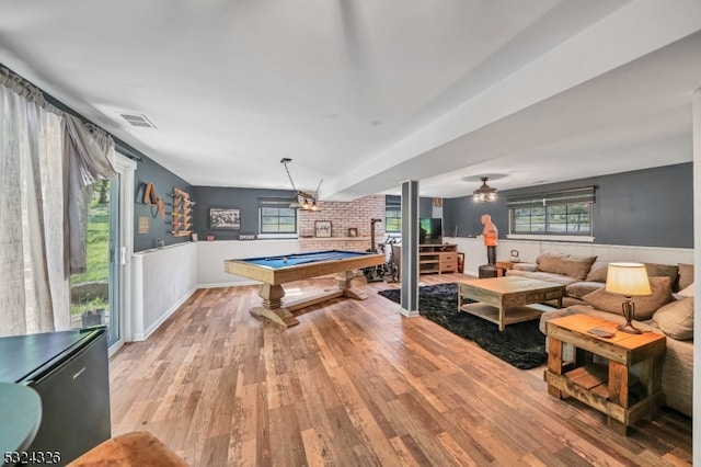 game room featuring billiards, plenty of natural light, ceiling fan, and light hardwood / wood-style flooring