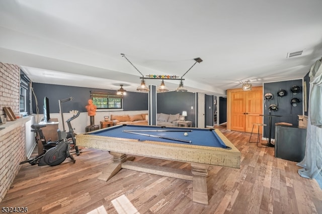 recreation room featuring brick wall, billiards, and light hardwood / wood-style flooring