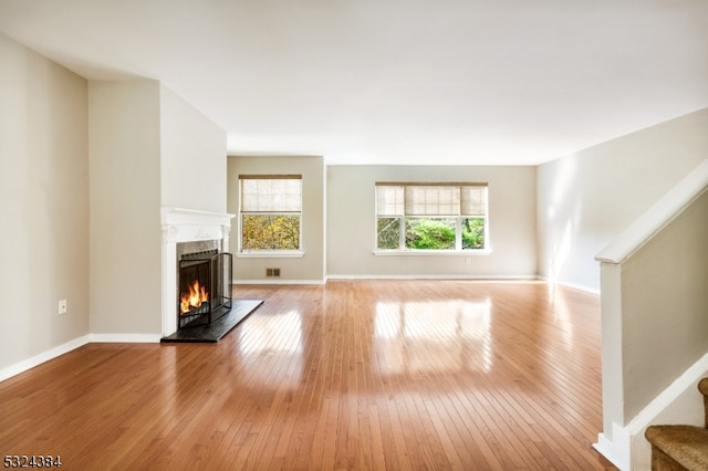 unfurnished living room featuring light hardwood / wood-style floors