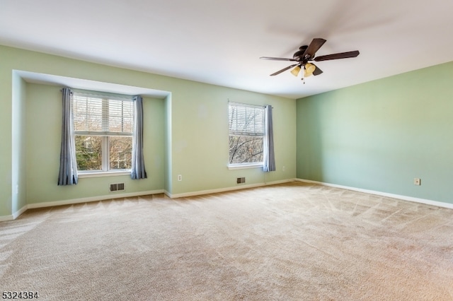 carpeted empty room with ceiling fan