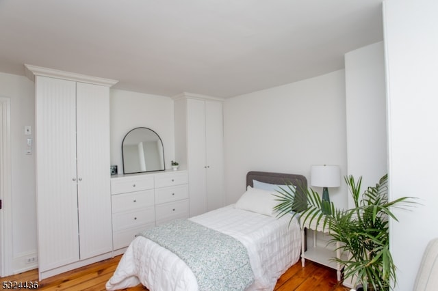 bedroom with wood-type flooring