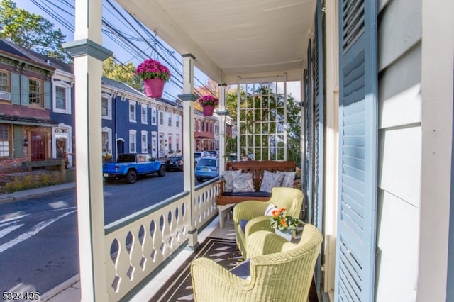 balcony featuring a porch