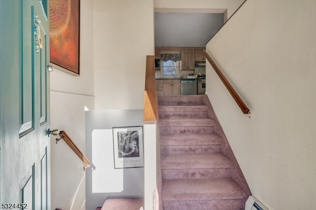 stairs featuring sink and a baseboard radiator