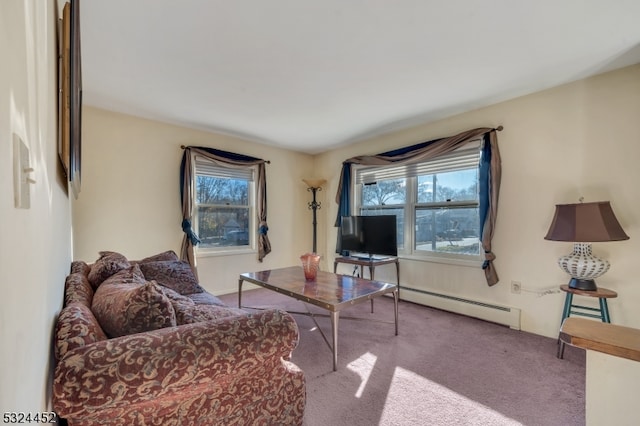 living room with light carpet, plenty of natural light, and a baseboard heating unit