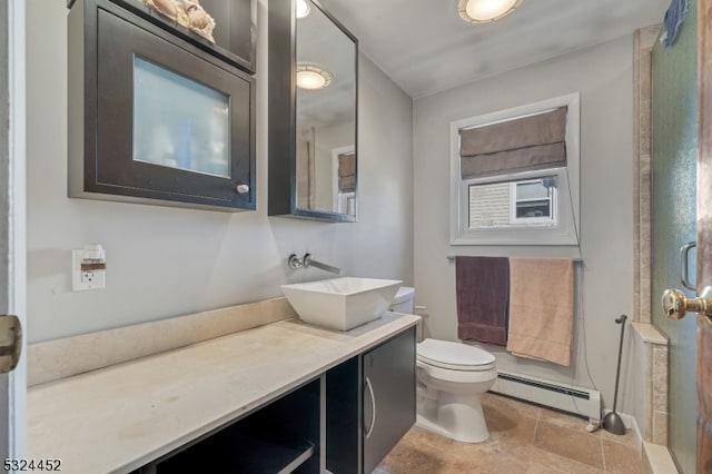 bathroom featuring vanity, toilet, walk in shower, and a baseboard radiator