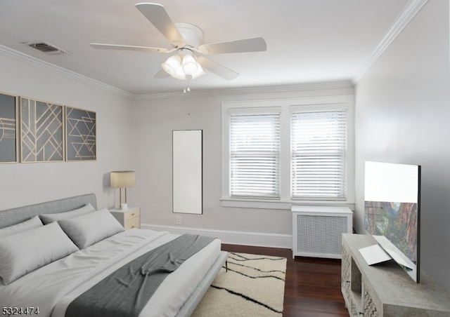 bedroom with radiator heating unit, dark hardwood / wood-style floors, ceiling fan, and ornamental molding