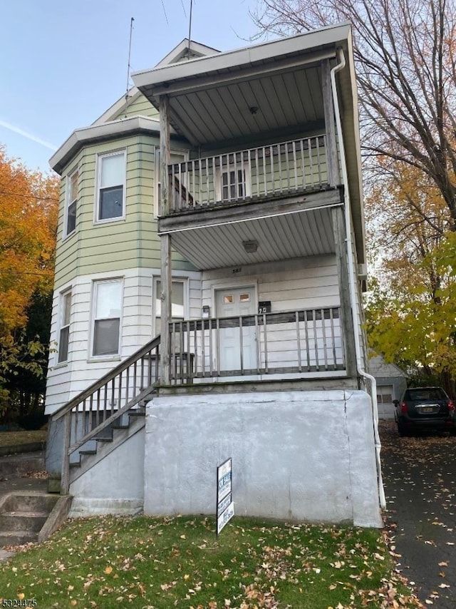 rear view of house with a balcony