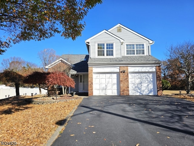 front facade with a garage