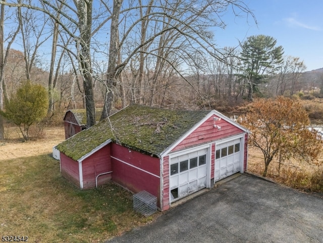 view of outbuilding with a garage